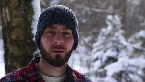 The Lumberjack working in a snow forest. A portrait handsome young man Stock Footage 149053509