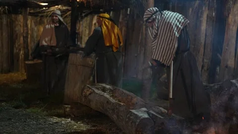 Lumberjacks Cut Tree Trunk Ready for Carving into a Boat on Bethlehem Play Stock Footage 325687212