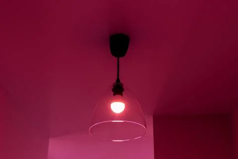 Luminary on the ceiling in the room in the red light Stock Photos