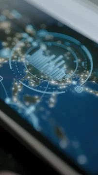 Luminous blue circular microchip visualization overlays a digital geographic 写真素材