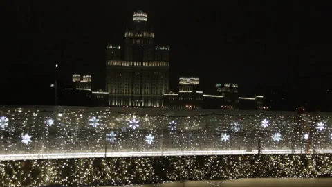 Luminous bright snowflakes coloured light bulbs of garland Video stock 144016747