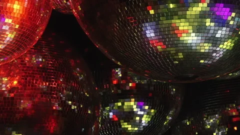 Luminous Disco Spheres Cast a Radiant Colorful Glow at an Evening Event Stock Footage 334927240