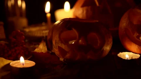 Luminous evil scary pumpkins with candles and leaves in concept of Halloween Stock Footage 139495167