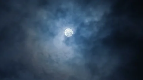 Luminous Full Moon Glowing Through Dark, Drifting Clouds. Full Moon Shining Stock Footage 312862670