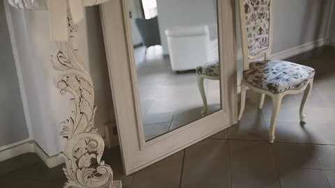 Luminous hall with mirror and pattern chair Stock Footage 86438419