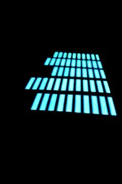 Luminous panel of pixels, with neon blue with green color and an equalizer Stock Photos