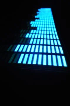 Luminous panel of pixels, with neon blue with green color and an equalizer Foto stock