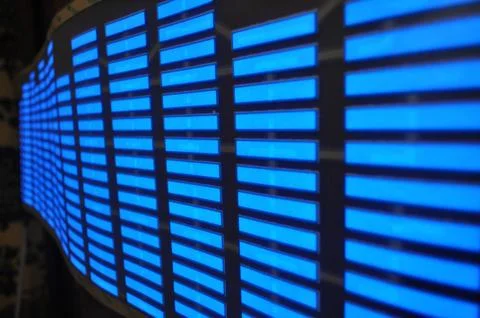 Luminous panel of pixels, with neon blue with green color and an equalizer Stock Photos