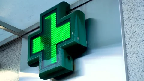 Luminous sign in the shape of a cross and green lighting Stock Footage 169048151
