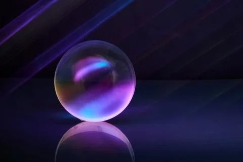 Luminous Sphere. A glowing orb reflects vibrant purple and blue hues on a shiny Stock Photos