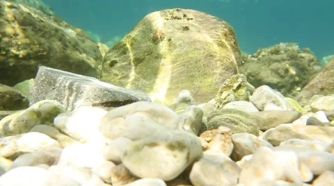 Luminous stone under water Stock Footage 69068965