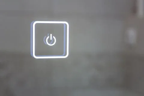 Luminous touch button of the bathroom mirror. turn on the shutdown. Stock Photos