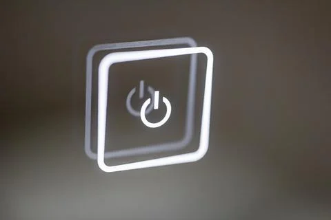 Luminous touch button close-up. turn on off. Stock Photos