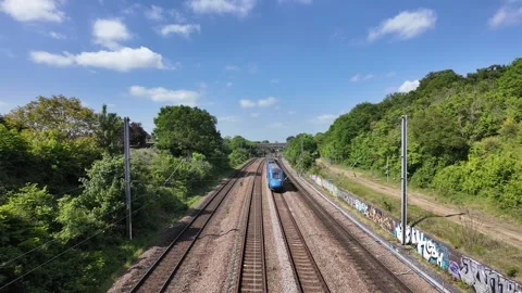 Lumo Class 803 Passing Beneath the Pinnacle at Sandy Stock Footage 313694211