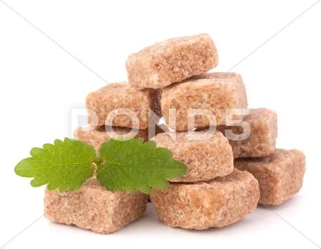 Lump brown cane sugar cubes Stock Photos