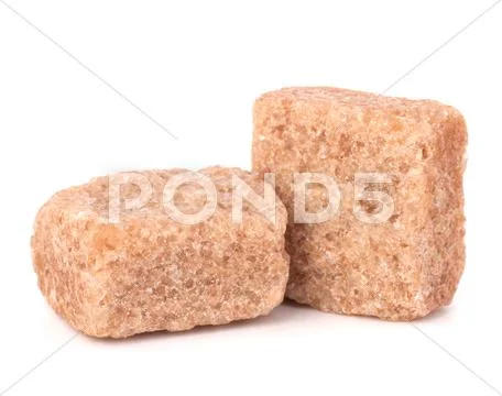 Lump brown cane sugar cubes Stock Photos