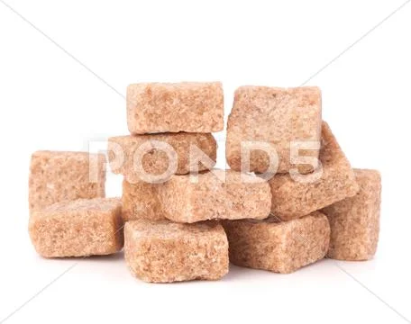 Lump brown cane sugar cubes Stock Photos