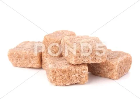 Lump brown cane sugar cubes Stock Photos