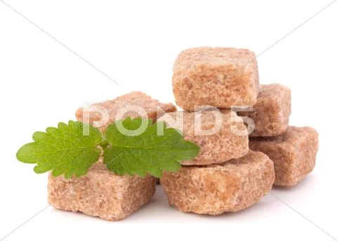 Lump brown cane sugar cubes Stock Photos