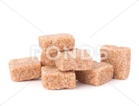 Lump brown cane sugar cubes Stock Photos