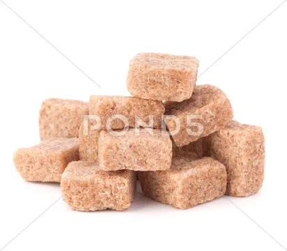 Lump brown cane sugar cubes Stock Photos