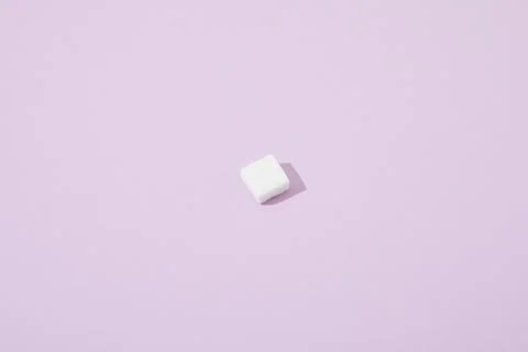 Lump sugar cube violet background Stock Photos