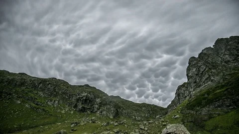 Lumpy, bumpy mammas or mammatus clouds. Mountain summer landscape. Stock-Footage 83731545
