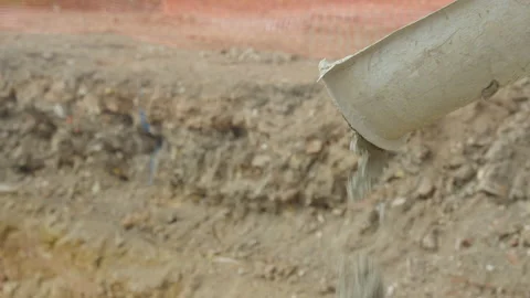 Lumpy Cement Drops From Funnel Stock Footage 239705938