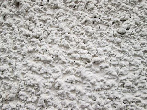Lumpy surface of hardened concrete. White texture of embossed stone pavement. Stock Photos