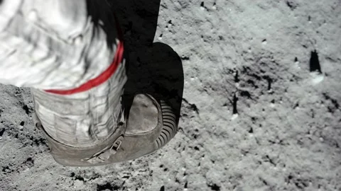 Lunar astronaut walking on the moon's surface and leaves a footprint in the Stock Footage 158606451