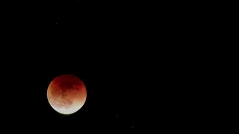 Lunar Eclipse 2018. January 31, 2018. the moon becomes red. View from the Stock Footage 85302673