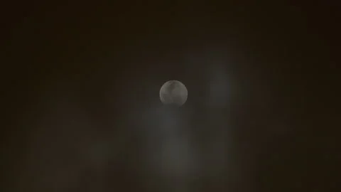 Lunar eclipse 2022 red moon sun clouds changing color Stock Footage 199942470