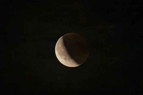Lunar eclipse beginning close-up from the right corner, the sun begins to com Stock Photos