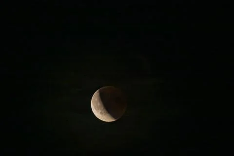 Lunar eclipse beginning close-up from the right corner, the sun begins to com Fotos Stock