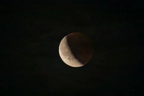 Lunar eclipse beginning close-up from the right corner, the sun begins to com Stock Photos