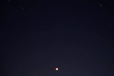 Lunar eclipse blood moon with starry in the night sky Stock Photos