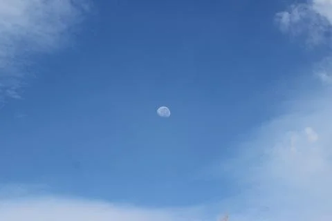 Lunar eclipse during the day with a clear sky. minimalist natural Stock Photos