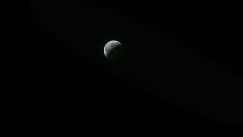 Lunar Eclipse Last Phase Coming Across The Moon Stock Footage 104387268