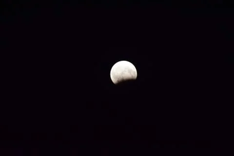 Lunar eclipse at night in mountains of Caucasus 写真素材