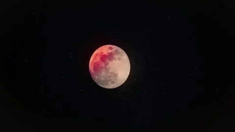 Lunar eclipse with red blood moon glowing in the dark night sky Stock Footage 347106170