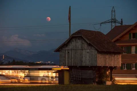 Lunar eclipse red moon scenery in rural place lucerne Stock Photos