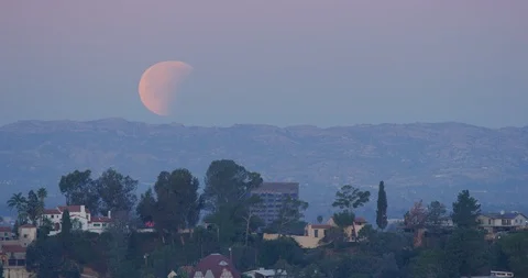 Lunar Eclipse as seen in Los Angeles, California Stock Footage 99159303