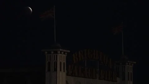 Lunar eclipse seen over Brighton Pier Stock-Footage 343822272
