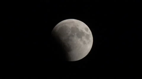 Lunar eclipse - shadow of Earth goes from Moon Stock Footage 101747351