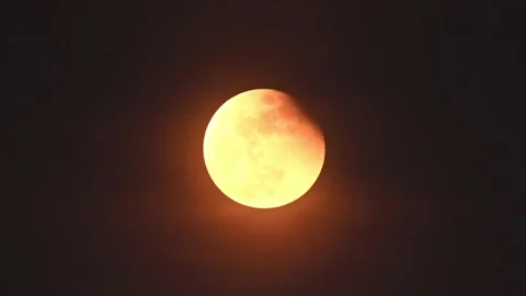 Lunar eclipse time-lapse with partial moon to full moon Stock Footage 221169889