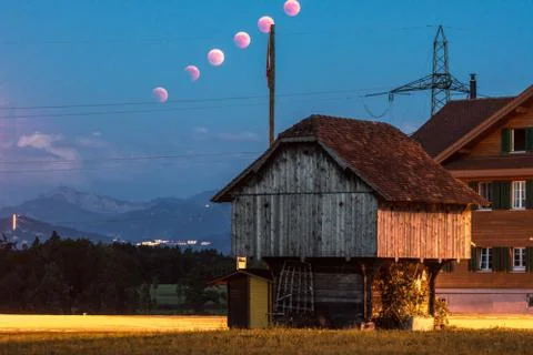 Lunar eclipse trail breathtaking scenery in rural place lucerne Stock Photos