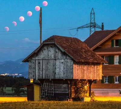 Lunar eclipse trail red moon rural place lucerne Stock Photos