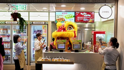 Lunar New Year Lion Dance Hong Kong Airport Shop Staff Smartphone Filming Cai Stock Footage 336189079