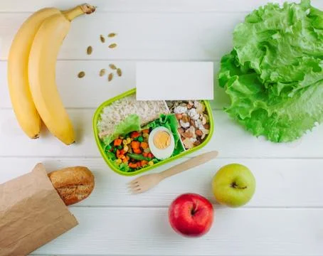 Lunch box with empty blank with copy space on white wooden background Stock Photos