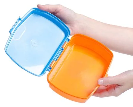 Lunch box in hand Stock Photos